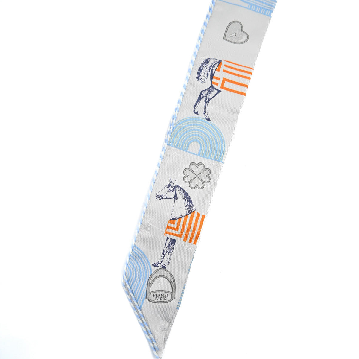 Hermès Garde-Robe Pop Twilly in grey silk 100%, featuring printed equestrian motifs and blue and orange accents, front view