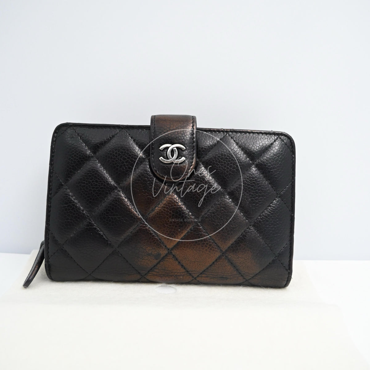 Chanel Bifold Medium Caviar Wallet With in black caviar leather, featuring interlocking CC clasp and side wrist strap, front view