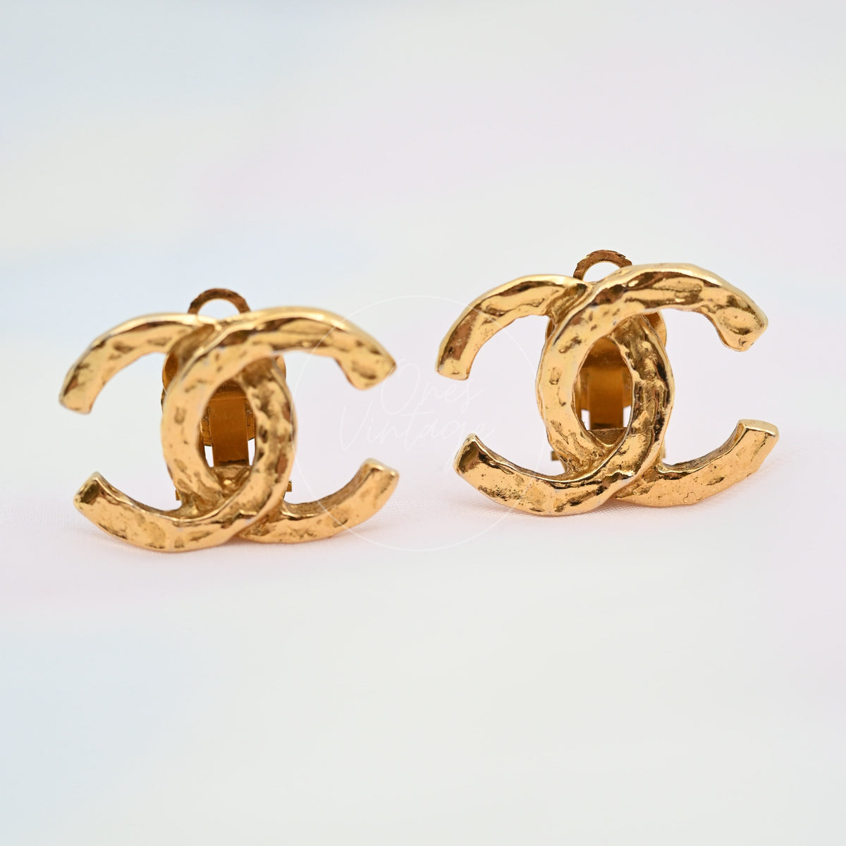 Chanel CoCo Mark Vintage 24K Plated Alloy Metal Ear Clips in 24K gold-plated alloy metal, featuring interlocking double-C motifs, front view