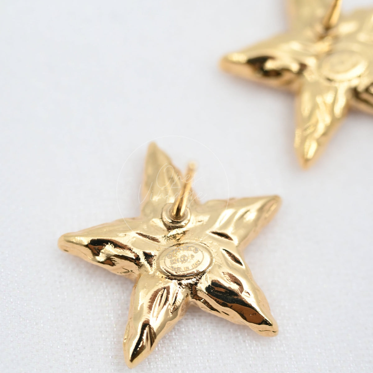 Chanel CC Mark on Gold Lava Star earrings, star-shaped earring and circular CC medallion detail