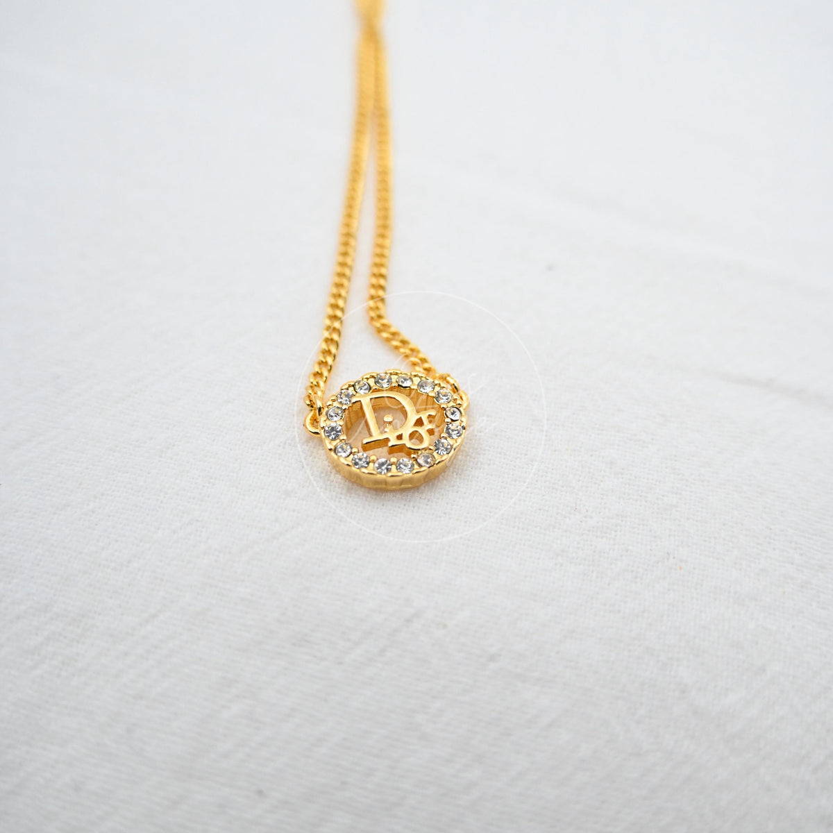Dior Crystal-embellished Logo-pendant Necklace, circular logo pendant and rhinestone border detail