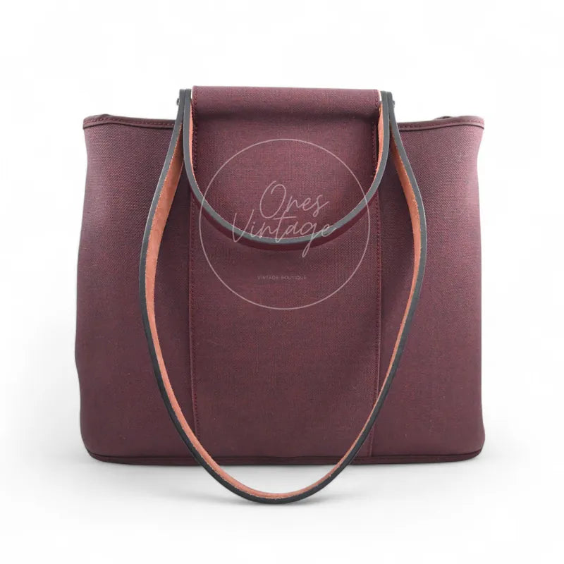 Hermès Cabag 32 tote in burgundy canvas with brown leather handles, T stamp, rear view