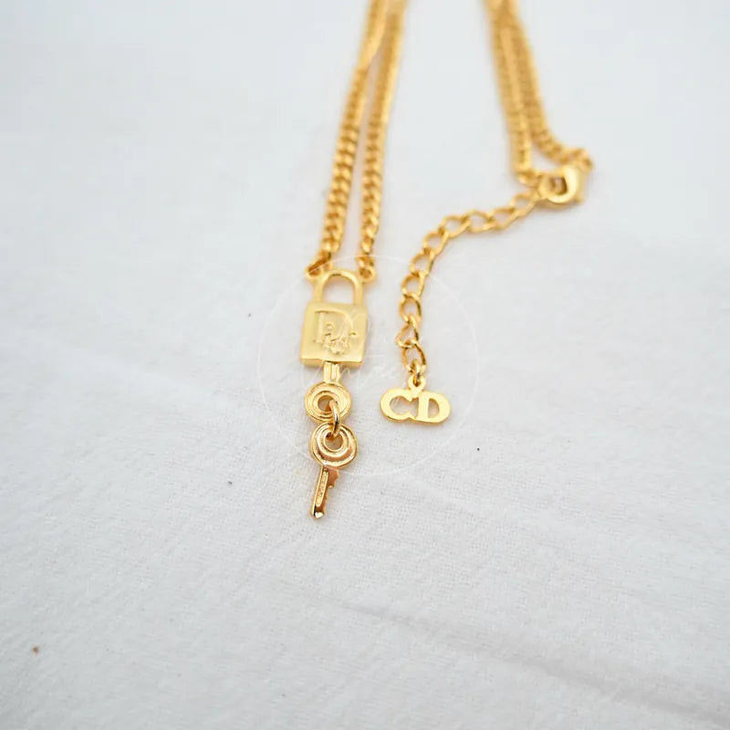 Dior Padlock Key Motif Necklace, padlock pendant and key charm detail