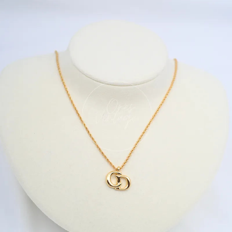 Dior CD Logo Necklace in plated gold, featuring interlocking logo pendant and fine chain, front view