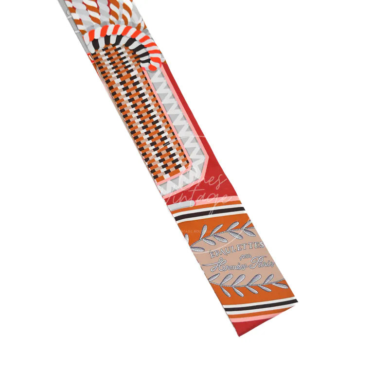 Hermès Epaulettes de Gala Twilly, graphic geometric print and contrasting striped border detail