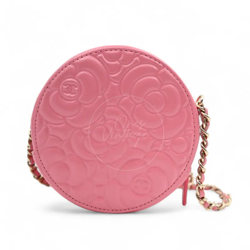 Chanel round clutch bag in pink camellia-embossed caviar leather with gold hardware, Series 29, rear view with camellia embossing