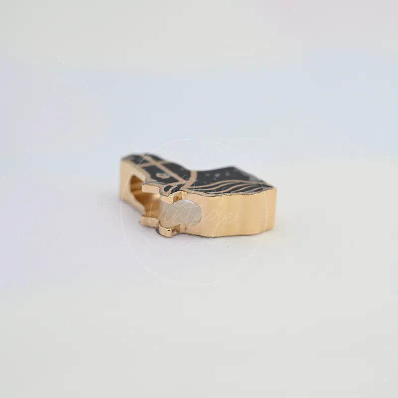 Hermès Quadriage Black & Gold Horse Head Twilly Ring in gold-plated, featuring horse-head motif and black patterned top, front view