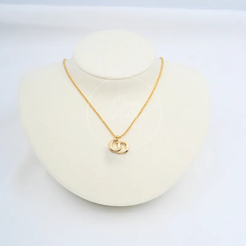 Dior CD Logo Necklace in plated gold, featuring interlocking logo pendant and fine chain, front view