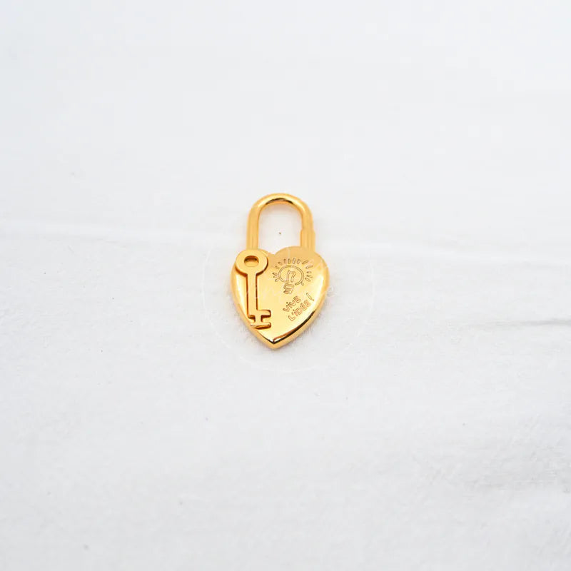 Hermès Année De La Fantaisie Cadena Lock, padlock with engraved emblem and arched shackle detail
