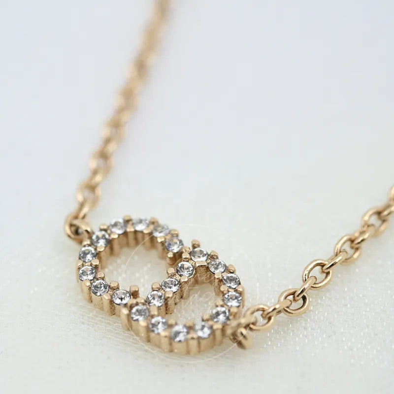 Dior Clair D Lune Bracelet, pendant with interlocking circular motifs and stone-set borders detail