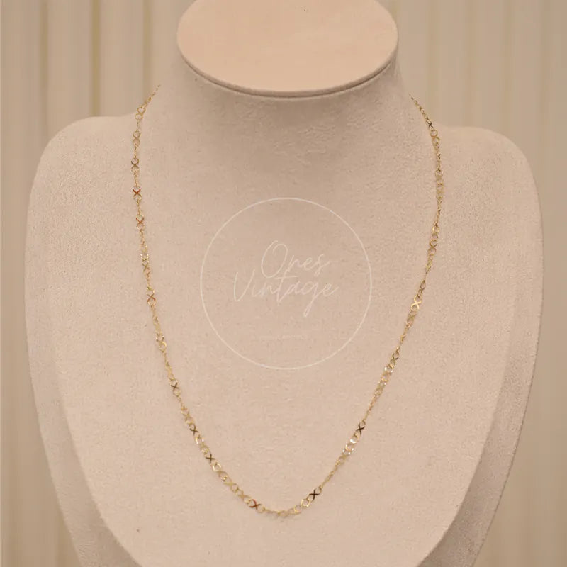 My Store 24K Yellow Infinity Logo Necklace in 24K yellow gold, featuring delicate linked chain and small decorative link accents, front view