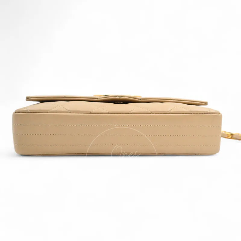 Chanel Vintage Single Flap bag with big CC in beige lambskin, featuring horizontal quilting and stitched leather edges, base view