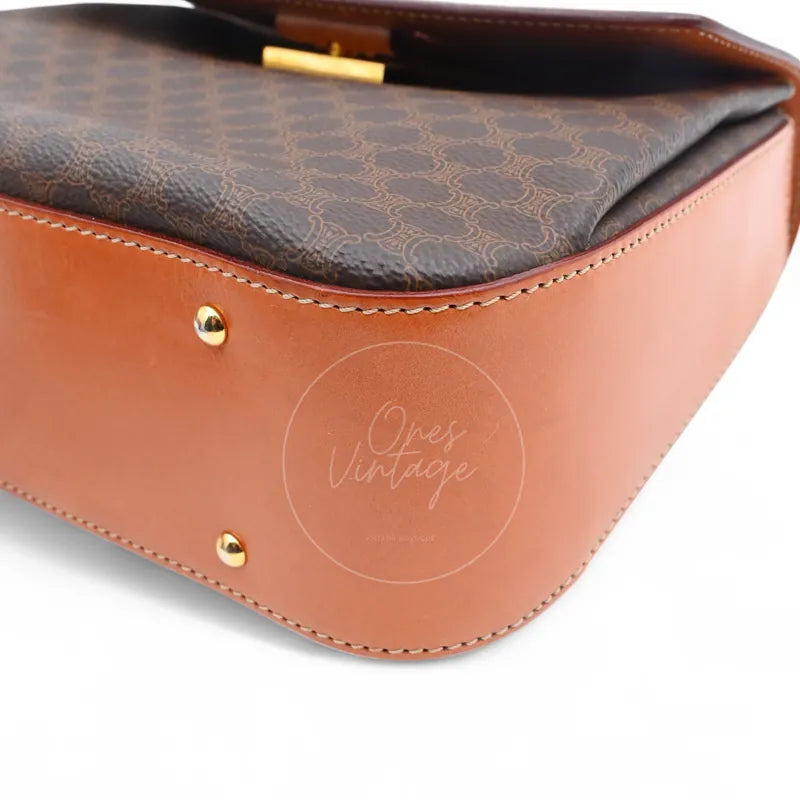 Celine Vintage Macadam Turn Lock Handbag in brown pvc, featuring monogram print and protective feet, base view