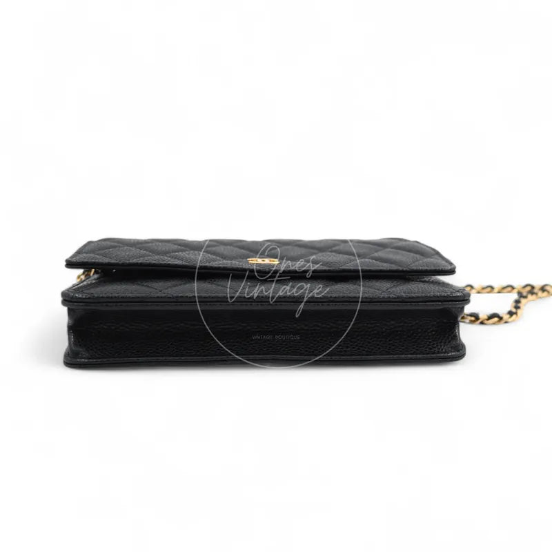 Chanel Wallet on Chain in black quilted caviar leather with gold hardware, Series 22, top edge and flap profile