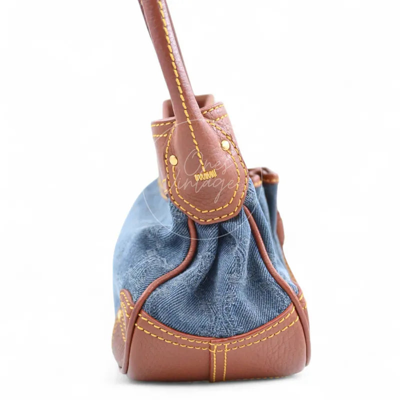 Celine Blason Triomphe Logo Shoulder Bag in brown and blue, featuring gathered denim body with leather shoulder strap, right side view