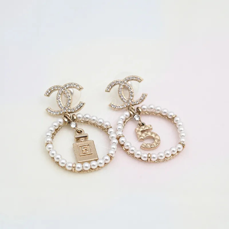Chanel No.5 Perfume Bottle CC Mark Circle Drop Earrings in gold-plated alloy metal and pearl, featuring interlocking CC top motifs, front view