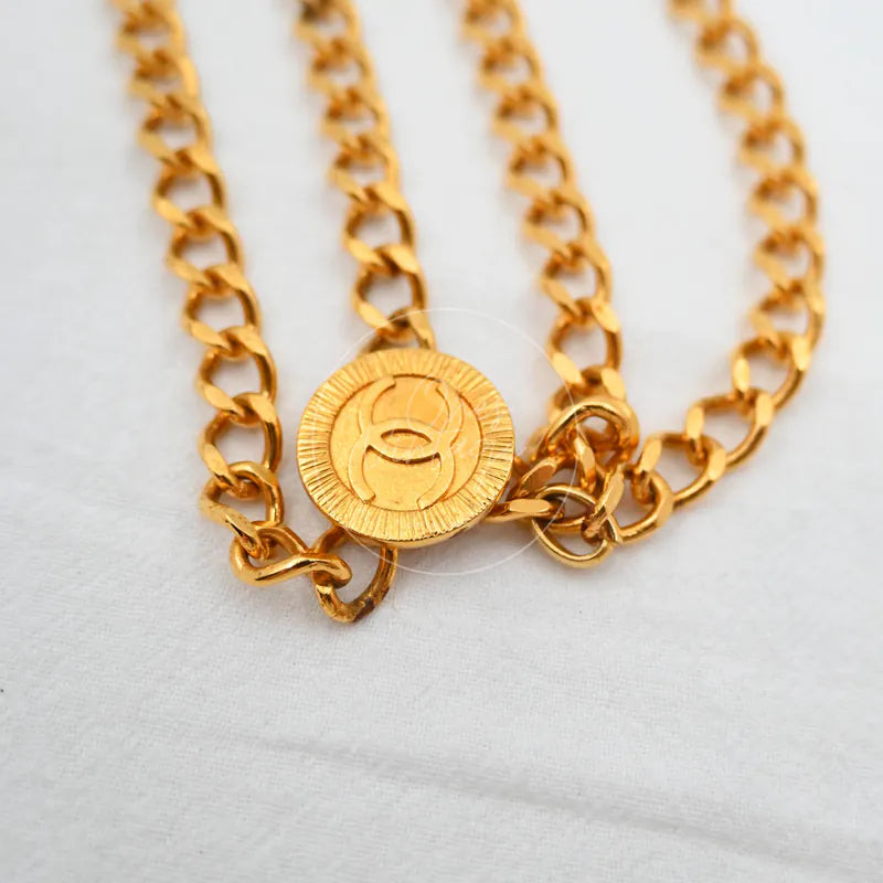 Chanel Chain CC Medallion Belt, pendant with interlocking CC emblem and radiating textured rim detail