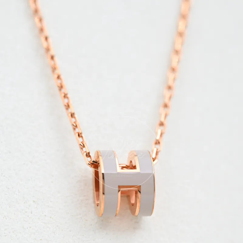 Hermès Mini Pop H Grey Pendant Necklace with Rose Gold, grey H-shaped pendant and rose-gold-tone chain detail