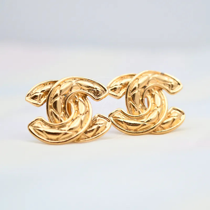 Chanel Vintage CC Earrings Clip-On (Large) in gold-plated, featuring interlocking CC motif and leaf-like textured contours, front view