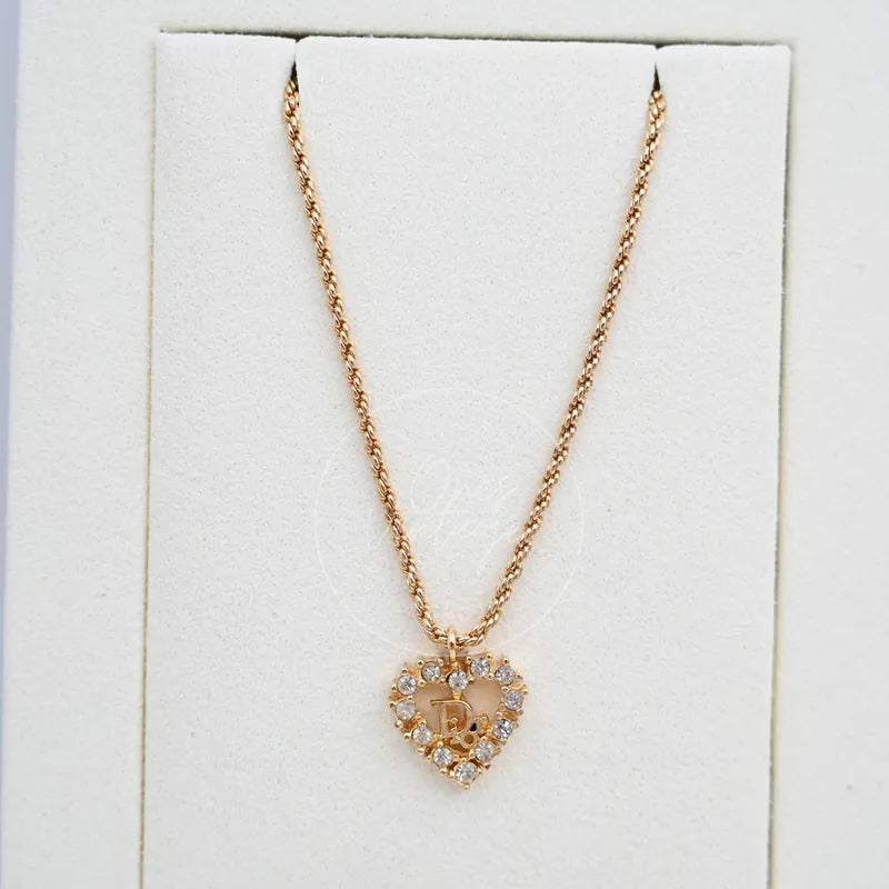 Dior Vintage Heart Shape CD Logo Necklace in metal and crystal, featuring heart-shaped pendant and crystal-studded border, front view