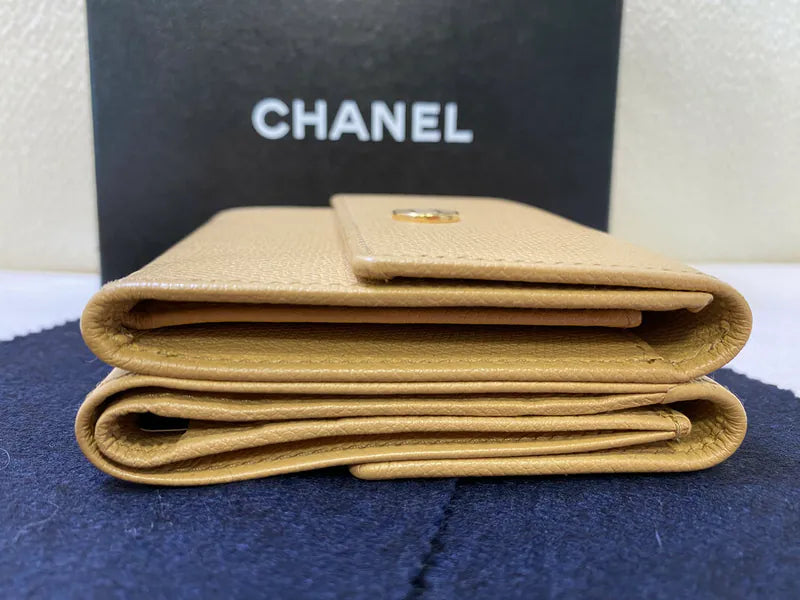 Chanel CC Logo Compact Trifold Wallet in beige calfskin, featuring top flap with CC logo closure and trifold folded profile, front three-quarter view