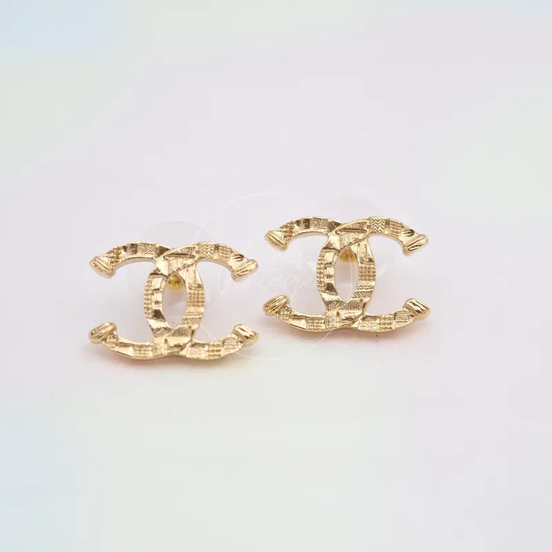 Chanel CC Mark in Checked Pattern Stud Earrings in gold-plated alloy metal, featuring pair of interlocking CC motifs, front view