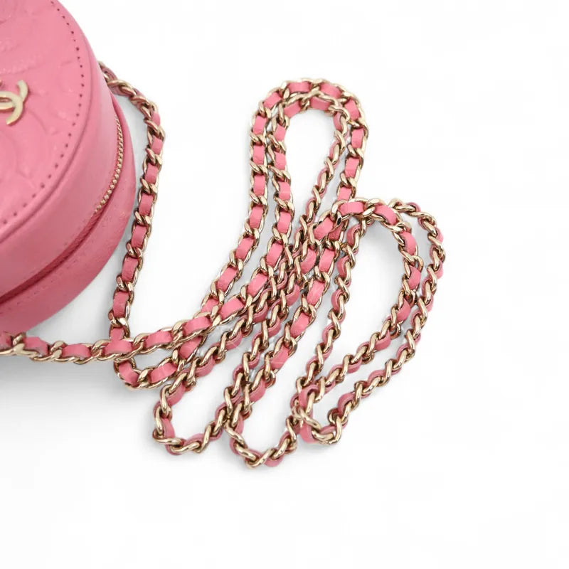 Chanel round clutch bag in pink camellia-embossed caviar leather with gold hardware, Series 29, full leather-interwoven chain strap
