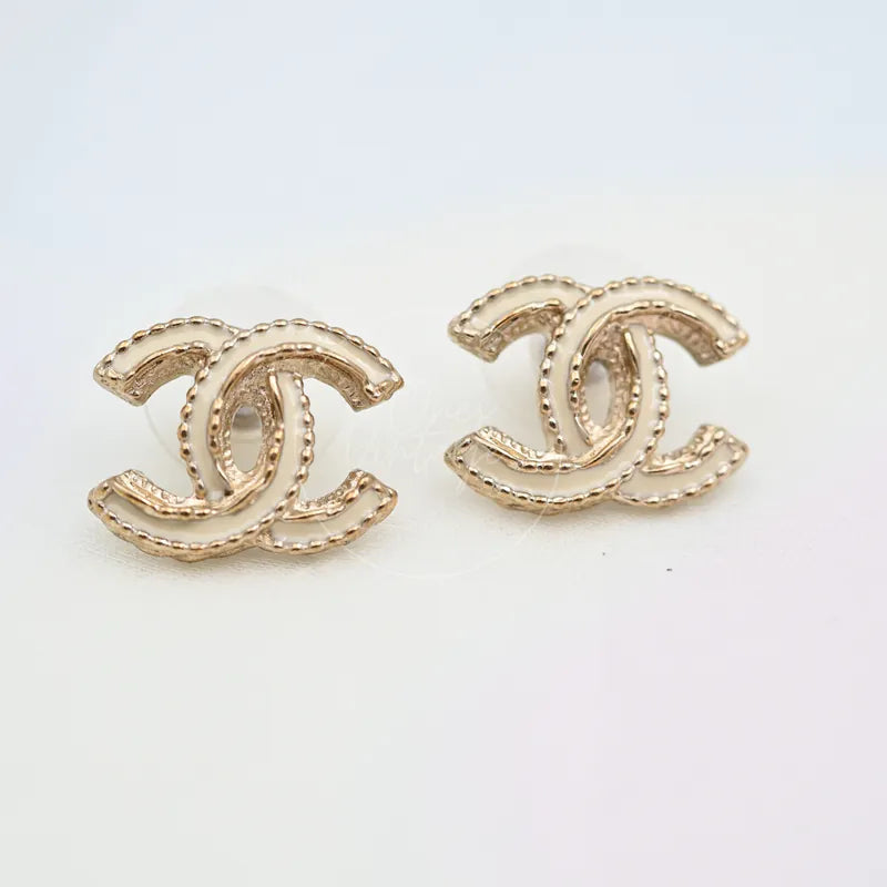 Chanel CC Logo Gold Plated Metal Earrings in gold-plated metal, featuring interlocking CC logo silhouette and beaded edge detailing, front view