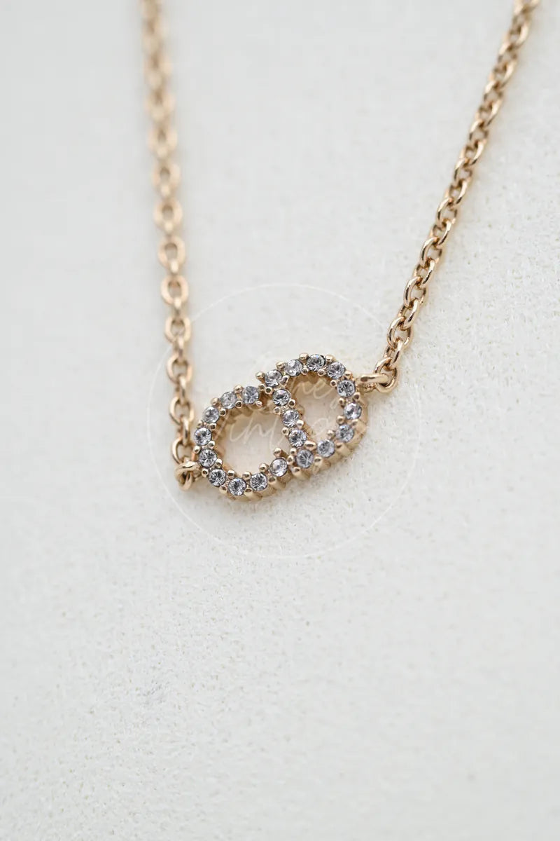 Dior Clair D Lune Bracelet, interlocking loop pendant and pavé stone accents detail