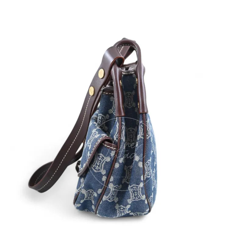 Celine Macadam Shoulder Bag in blue denim with gold-tone hardware, featuring leather drawstring closure with leather shoulder strap, right side view