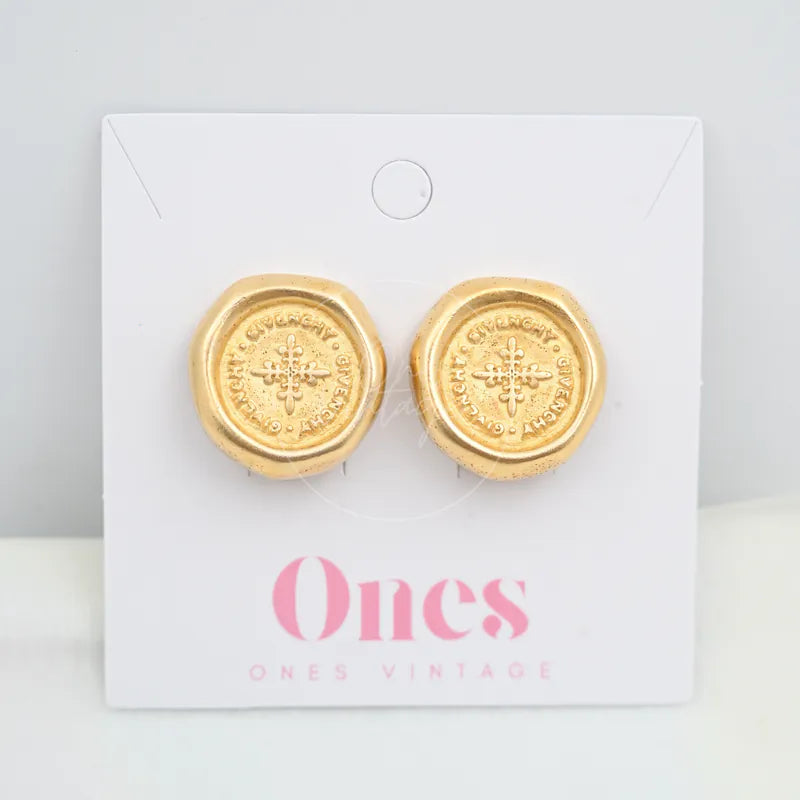 Givenchy Vintage Circle Wax Seal Stamp Earclips in alloy metal, featuring circular medallion faces and embossed cross motifs, front view