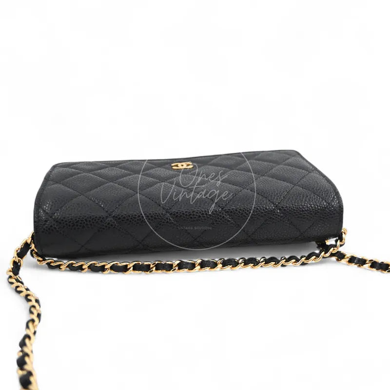Chanel Wallet on Chain in black quilted caviar leather with gold hardware, Series 22, base view with chain