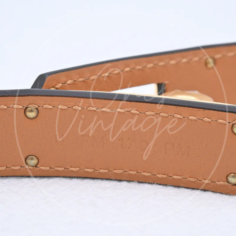 Hermès Kelly Belt epsom leather, stitching with contrast edge piping and metal rivets detail