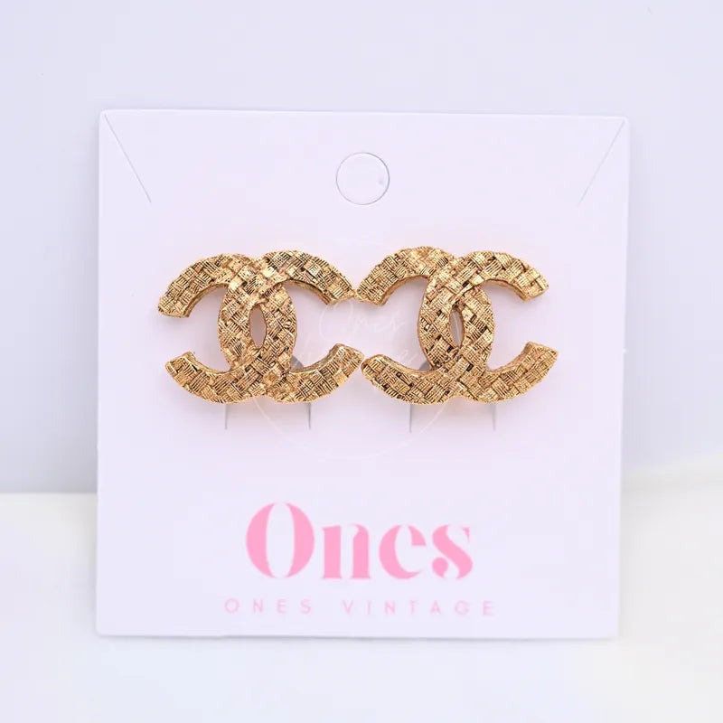Chanel Vintage Tweed CC Mark Ear-Clips Earrings in gold-plated metal, featuring textured woven surface and interlocking CC motif, front view