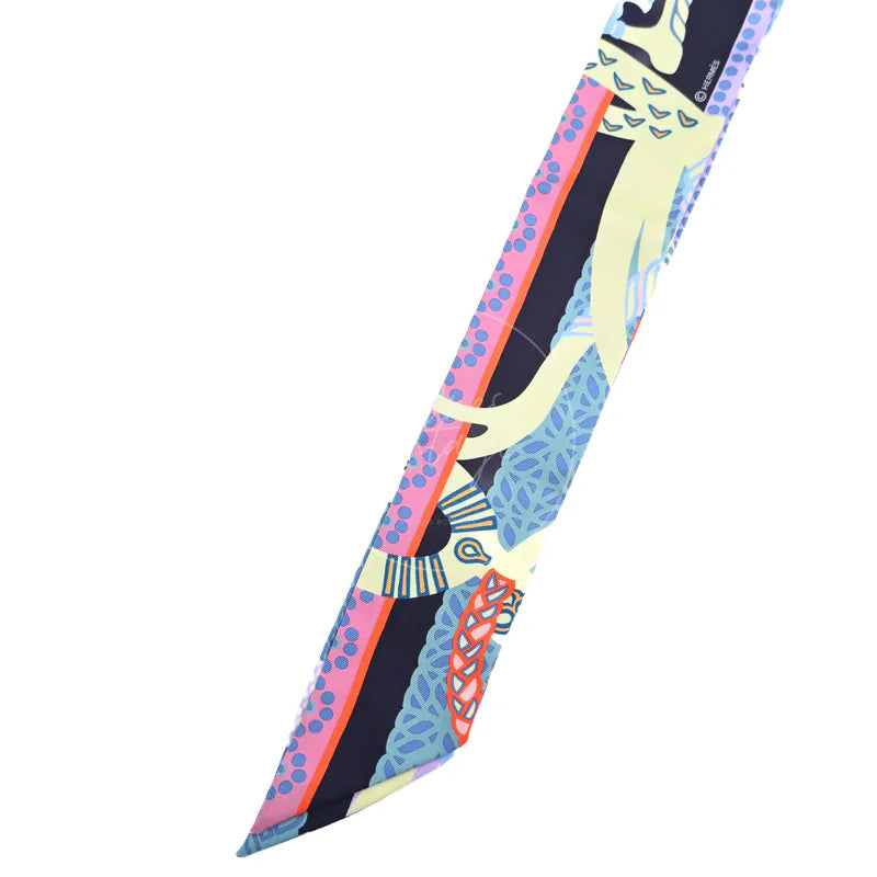 Hermès Fantaisie d'Etriers Twilly in marine, mauve and jaune soufre silk 100%, featuring multicolour equestrian-inspired print, front view