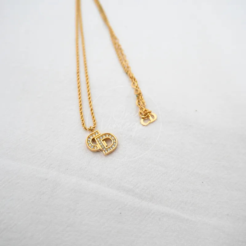 Dior CD Logo Plated Necklace in plated gold and rhinestone, featuring CD logo pendant and rhinestone detailing, front view