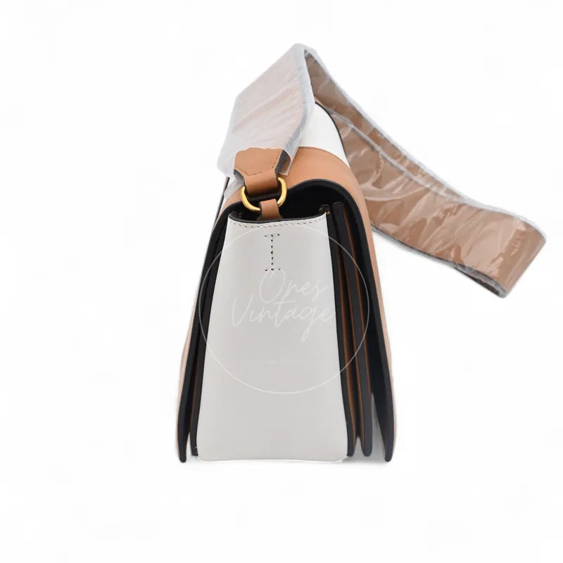 Celine Medium Frame Bag in tan and optic white calfskin, featuring side gusset with wrapped shoulder strap, right side view