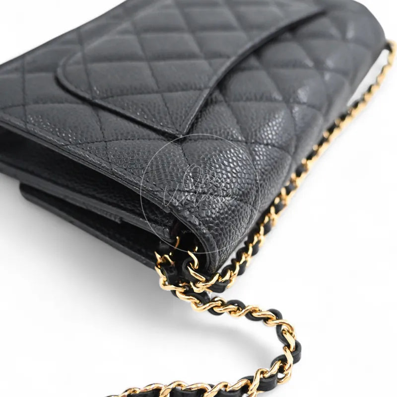 Chanel Wallet on Chain in black quilted caviar leather with gold hardware, Series 22, right side gusset and chain attachment