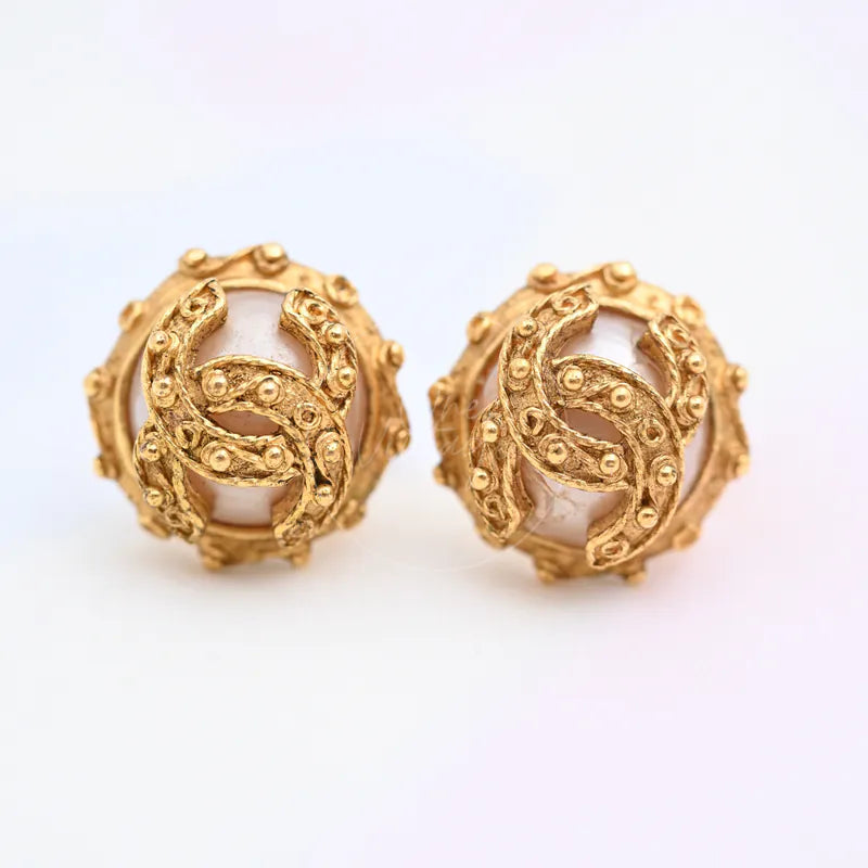 Chanel Vintage CC Faux-Pearl Clip-on Earrings in faux pearl and gold-plated, featuring interlocking CC motifs and round pearl centers, front view