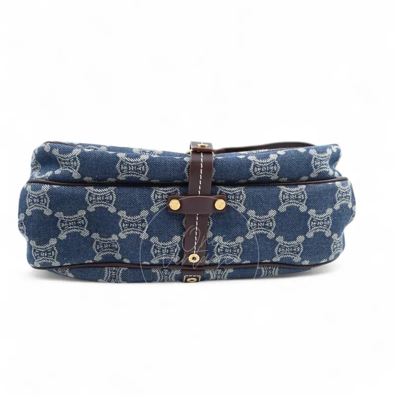 Celine Macadam Shoulder Bag in blue denim with gold-tone hardware, featuring repeating monogram pattern and central leather strap, front view