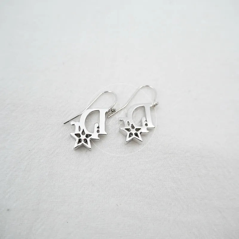 Dior Sliver Star Logo Drop Earrings in sterling silver, featuring Dior logo charms and star-shaped cutout accents, front view