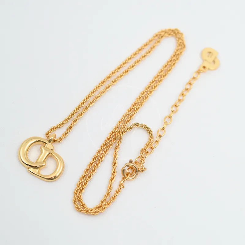 Dior CD Logo Necklace in plated gold, featuring interlocking CD logo pendant and round clasp, front view