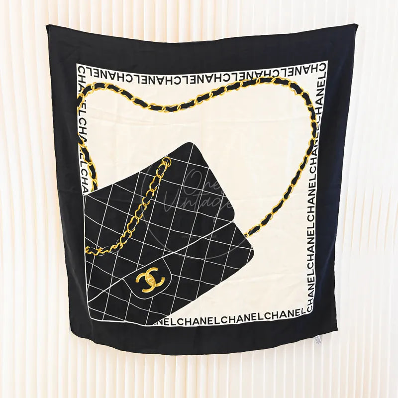 Chanel and Scarf in black and white silk, featuring Chain and quilted bag print and Black border, front view