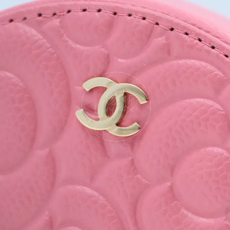 Chanel round clutch bag in pink camellia-embossed caviar leather with gold hardware, Series 29, gold CC logo and camellia leather close-up