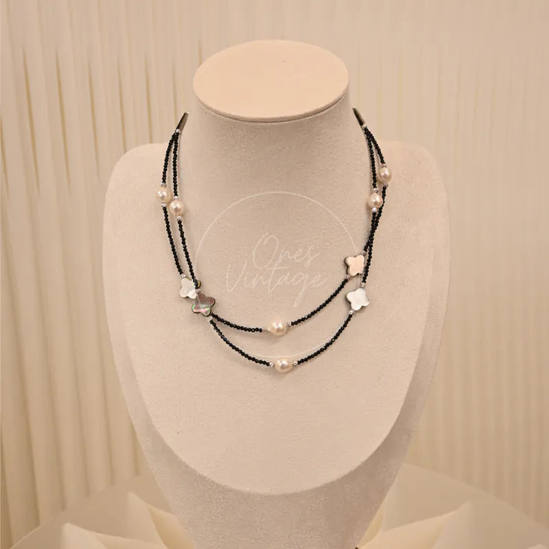 Akoya Necklace With in akoya pearl, mother-of-pearl, 925 silver and black spinel, featuring layered black beaded chain, front view