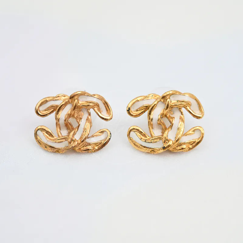 Chanel CC Logo Earrings in gold-plated, featuring paired interlocking CC motifs and curved openwork design, front view