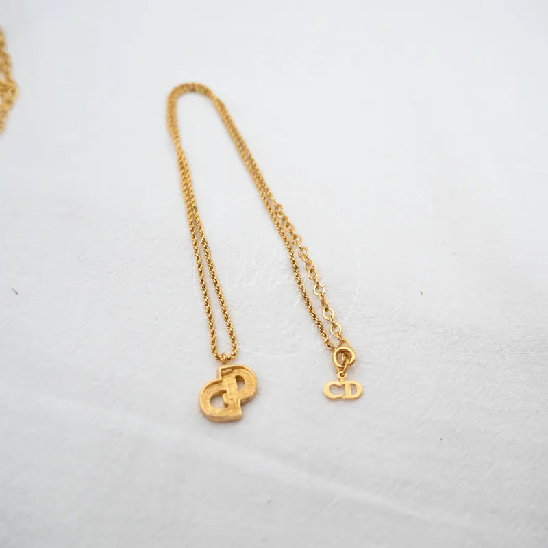 Dior CD Logo Plated Necklace in plated gold and rhinestone, featuring interlocking CD pendant and fine chain, front view