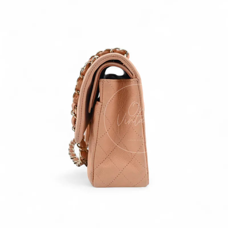 Chanel CF25 Medium Classic Flap Bag in peach caviar with gold-tone hardware, featuring structured gusset with chain shoulder strap, right side view