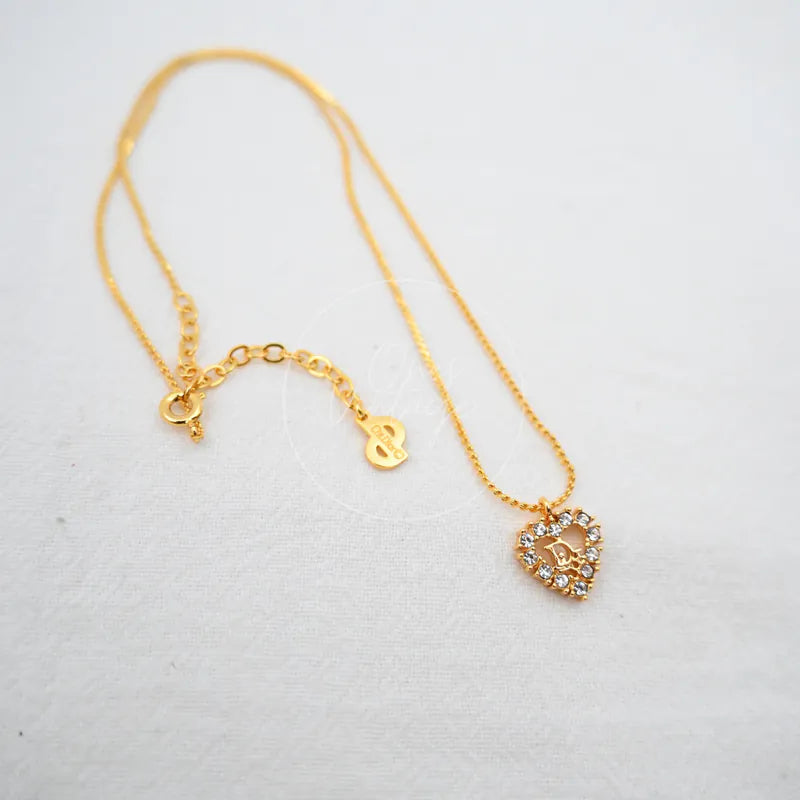 Dior Logo-heart Pendant Necklace in alloy metal, featuring heart-shaped pendant and ornate stone accents, front view