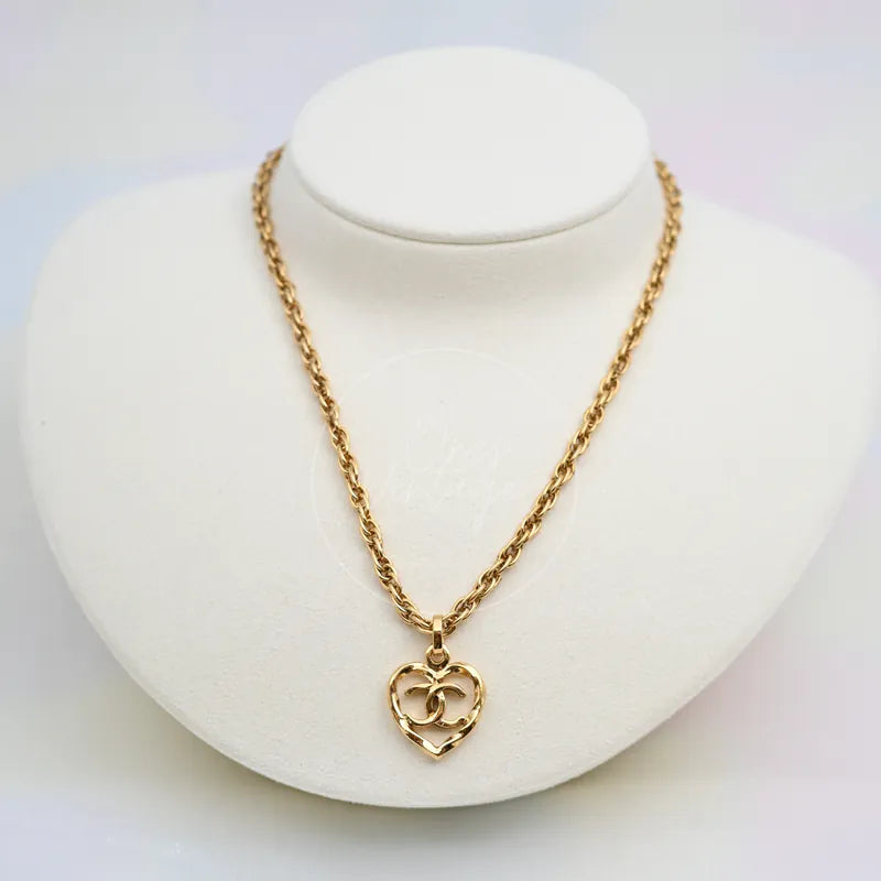 Chanel Heart Shape CC Mark Pendant Necklace in 24K gold-plated, featuring interlocking CC motif and heart-shaped pendant, front view